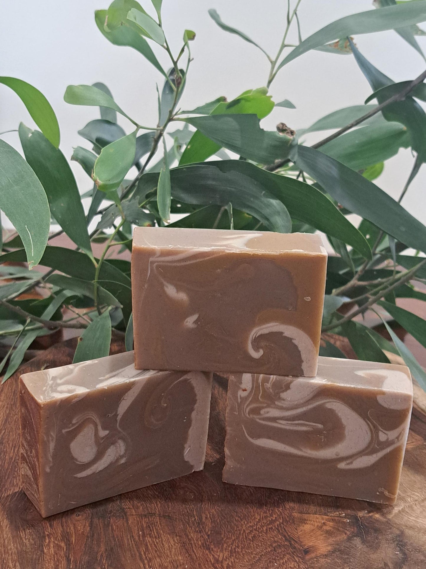 Australian handmade brown soap with white swirl from Lupus Rex shen soap featuring dead sea mud and shea butter