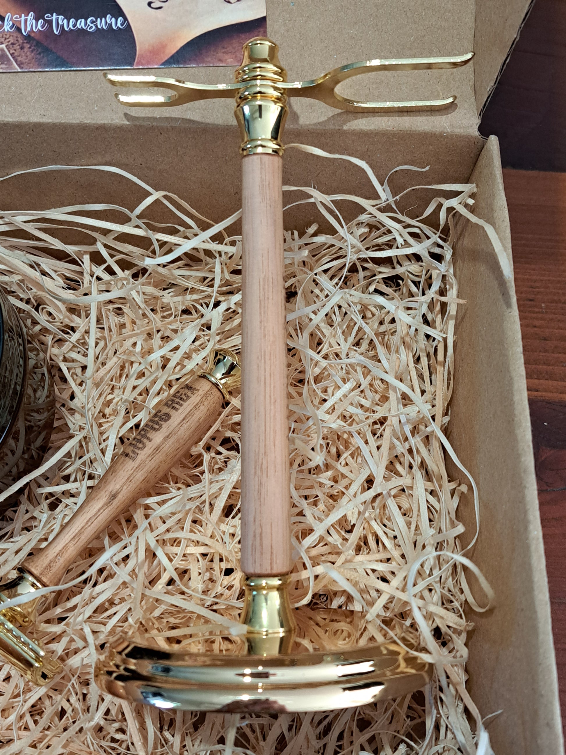Wooden razor and shave brush stand with metal fittings in the La Buse Gift Box.