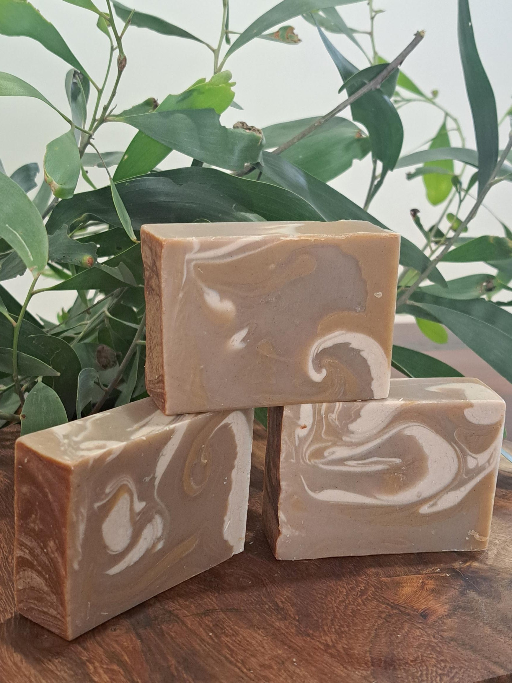 Australian handmade brown soap with white swirl from Lupus Rex shen soap featuring dead sea mud and shea butter