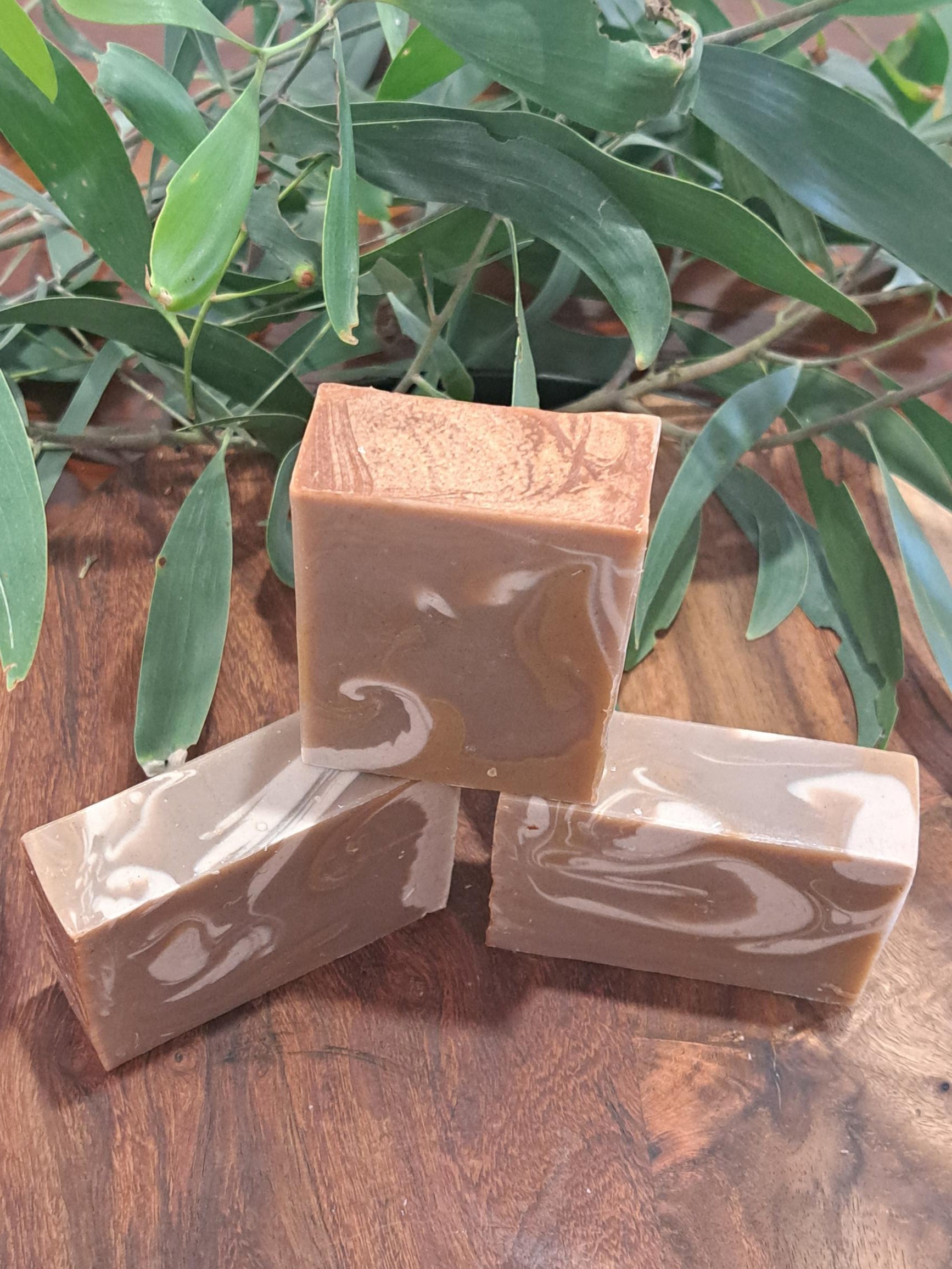 Australian handmade brown soap with white swirl from Lupus Rex shen soap featuring dead sea mud and shea butter