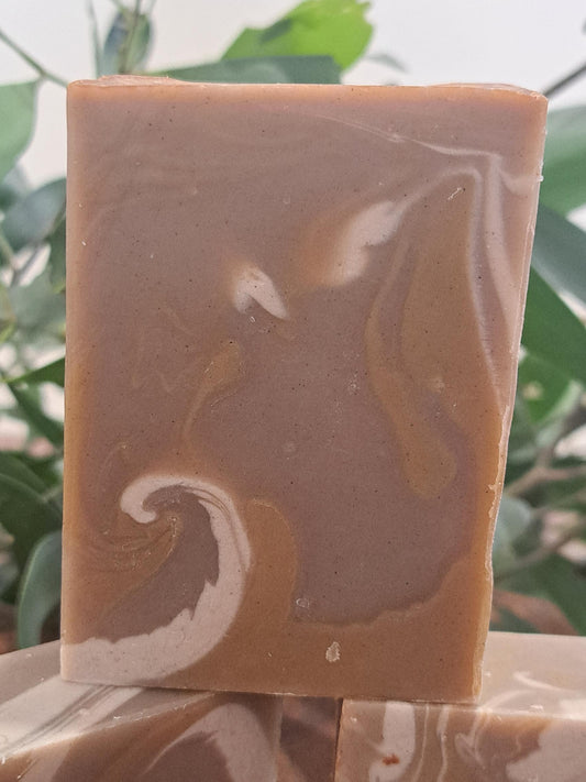 Australian handmade brown soap with white swirl from Lupus Rex shen soap featuring dead sea mud and shea butter