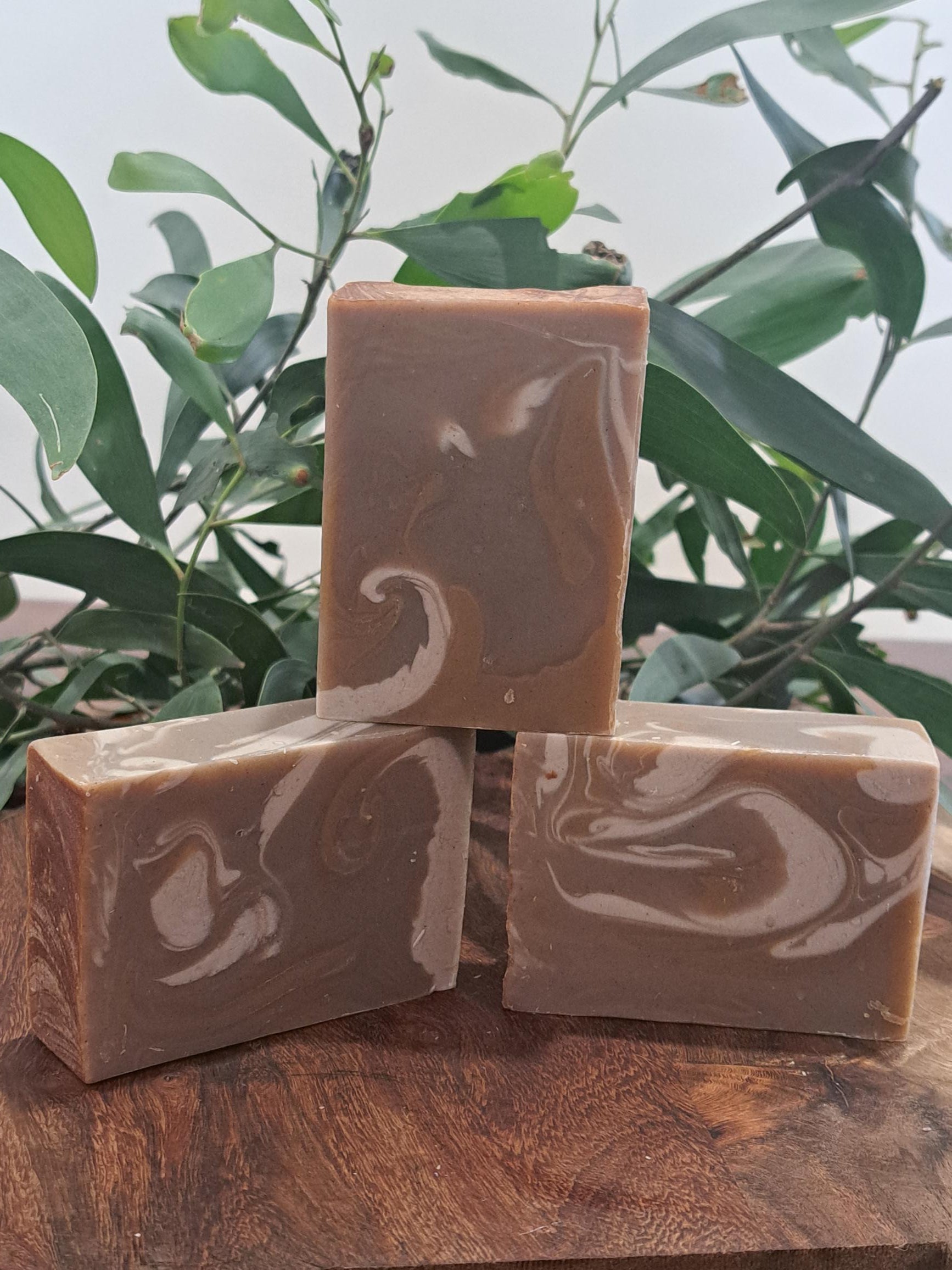 Australian handmade brown soap with white swirl from Lupus Rex shen soap featuring dead sea mud and shea butter
