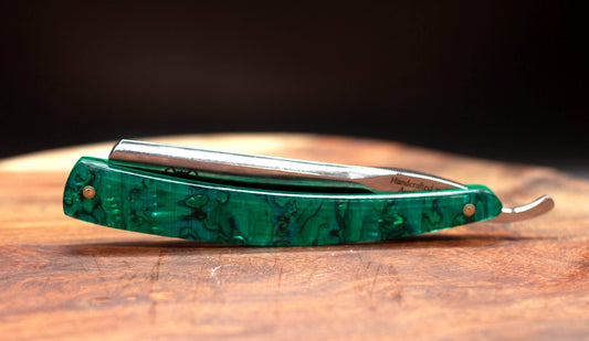 Australian handcrafted straight razor with green abalone shell scales. Lupus Rex and wolf head etched onto the blade with Handcrafted in Australia on the tang