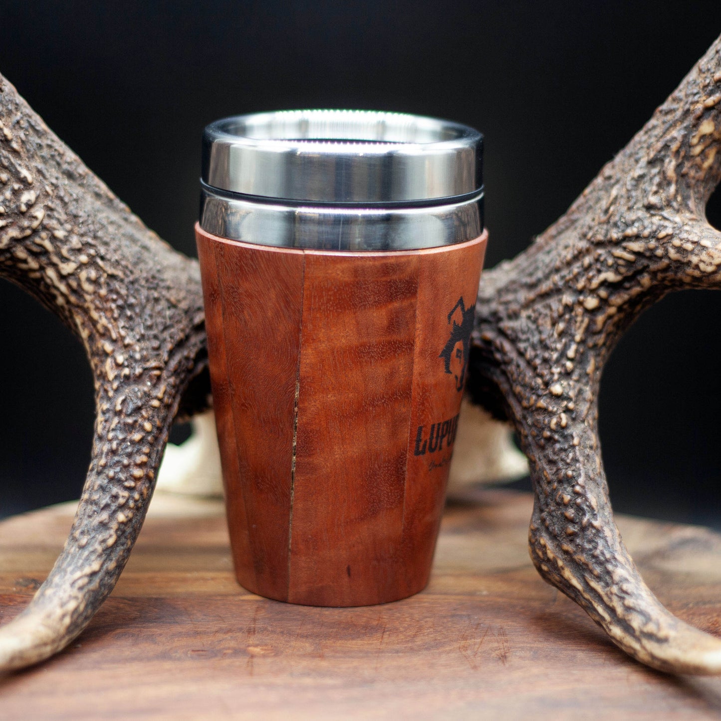 Timber exterior handcrafted travel mug with stainless steel interior. Holds approx. 295ml or 10 oz which is roughly a small to medium at most cafes. Not dishwasher safe. Hand wash only. Don't immerse timber exterior in water. Lupus Rex logo with wolf head branded on  timber