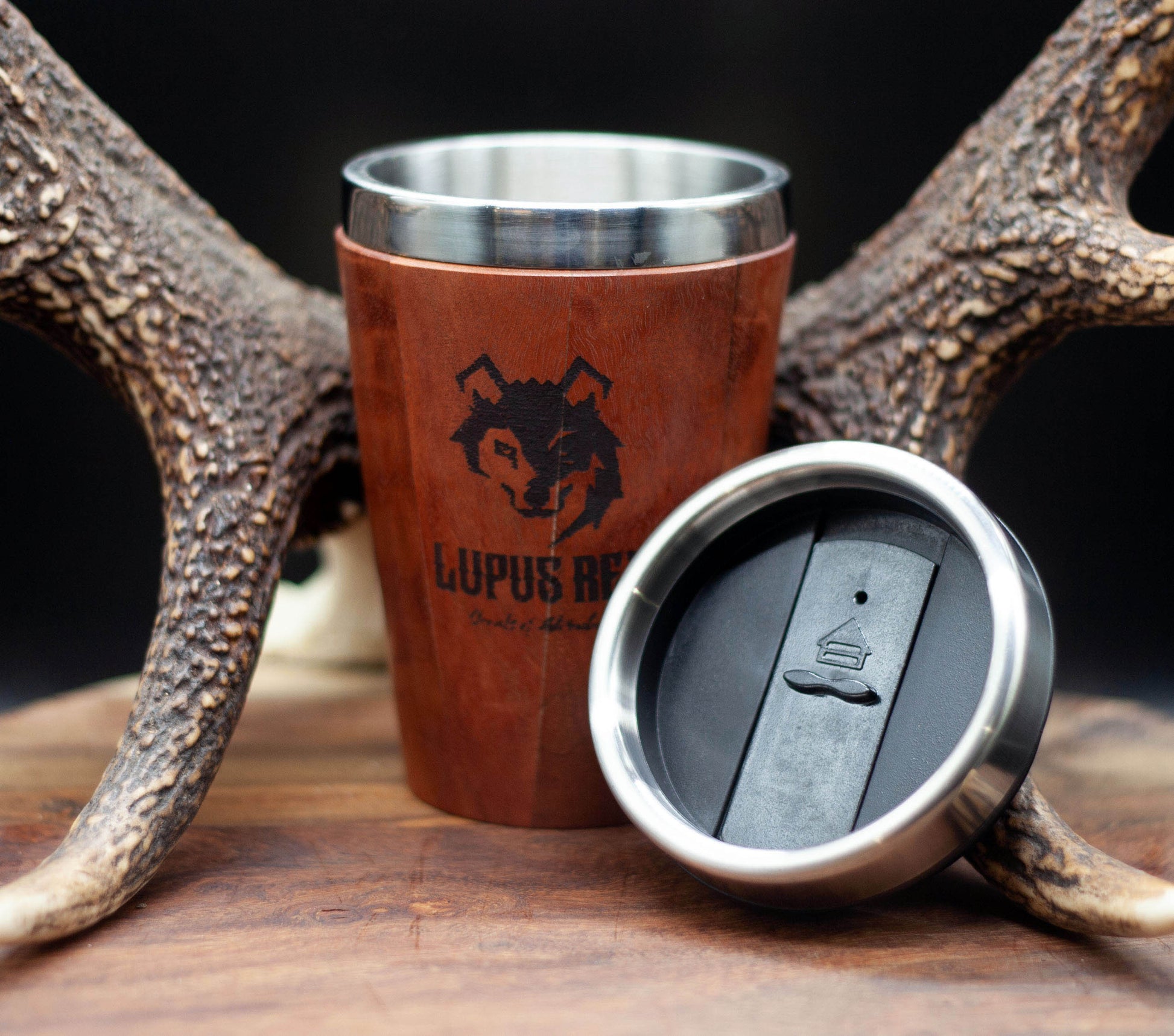 Timber exterior handcrafted travel mug with stainless steel interior. Holds approx. 295ml or 10 oz which is roughly a small to medium at most cafes. Not dishwasher safe. Hand wash only. Don't immerse timber exterior in water. Lupus Rex logo with wolf head branded on  timber