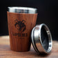 Australian handcrafted light to mid brown coloured timber exterior travel mug with stainless steel interior. Holds approx. 295ml or 10 oz which is roughly a small to medium at most cafes. Not dishwasher safe. Hand wash only. Don't immerse timber exterior in water. Lupus Rex logo with wolf head branded on  timber